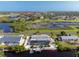 Waterfront home with a screened-in pool and dock, offering direct access to the canal at 1030 Haste Ln, Englewood, FL 34223