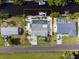 Aerial view of the property with a focus on its location, surrounding neighborhood and canal access at 1030 Haste Ln, Englewood, FL 34223