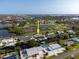 This waterfront house has canal access and neighborhood views as seen from an aerial view at 1030 Haste Ln, Englewood, FL 34223