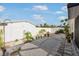 Spacious backyard featuring mature tropical landscaping, providing a serene and private outdoor retreat at 1030 Haste Ln, Englewood, FL 34223
