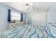 Sunny bedroom features natural light, ensuite bathroom and closet at 1030 Haste Ln, Englewood, FL 34223