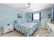 Well-lit bedroom features two windows and white dressers at 1030 Haste Ln, Englewood, FL 34223