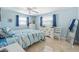 Light and airy bedroom with stylish furnishings and neutral-toned walls at 1030 Haste Ln, Englewood, FL 34223