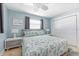 Relaxing bedroom with coastal-themed decor, ceiling fan, and ensuite bathroom at 1030 Haste Ln, Englewood, FL 34223