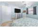 Light and bright bedroom with TV, ceiling fan and view of the neighborhood at 1030 Haste Ln, Englewood, FL 34223