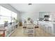 Bright dining area with plenty of sunlight and access to the kitchen at 1030 Haste Ln, Englewood, FL 34223