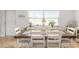 Open dining area with a bright window and neutral color scheme at 1030 Haste Ln, Englewood, FL 34223