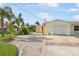 Charming home featuring a well-maintained exterior, an attached garage, and a convenient storage shed at 1030 Haste Ln, Englewood, FL 34223