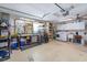 Organized garage space with ample storage, washer, dryer, and utility sink for added convenience at 1030 Haste Ln, Englewood, FL 34223