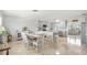 Bright and spacious dining area adjacent to an open-concept kitchen at 1030 Haste Ln, Englewood, FL 34223