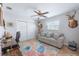 Bright and comfortable living room with neutral-toned walls and accent rug at 1030 Haste Ln, Englewood, FL 34223