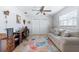 Well-appointed office with ample storage, desk, seating, and a cozy sofa with natural lighting at 1030 Haste Ln, Englewood, FL 34223