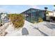 Screened-in pool with dock access and canal view at 1030 Haste Ln, Englewood, FL 34223