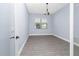 A secondary bedroom with wood floors and natural light at 11044 Hogan Cir, Englewood, FL 34223