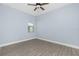 Bedroom with neutral walls, a ceiling fan, and wood-look tile flooring at 11044 Hogan Cir, Englewood, FL 34223