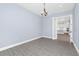 This open bedroom has gray wood floors and ample natural light at 11044 Hogan Cir, Englewood, FL 34223