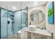 Stylish bathroom featuring a modern glass-enclosed shower and round vessel sink on a marble counter at 1401 S Mccall Rd # 205, Englewood, FL 34223