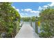 Take a scenic walk on the community's private boat dock surrounded by lush landscaping at 1401 S Mccall Rd # 205, Englewood, FL 34223