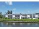 Waterfront condo offers serene water views, private dock access, and lush landscaping at 1401 S Mccall Rd # 205, Englewood, FL 34223
