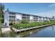 Luxurious waterfront living with private dock access, lush landscaping, and water views at 1401 S Mccall Rd # 205, Englewood, FL 34223
