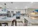 Renovated kitchen with custom backsplash, updated appliances and breakfast bar at 1401 S Mccall Rd # 205, Englewood, FL 34223