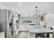 Eat-in kitchen boasts stainless appliances and a bar with seating at 1401 S Mccall Rd # 205, Englewood, FL 34223