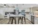 A kitchen island offers seating, prep space and stainless appliances at 1401 S Mccall Rd # 205, Englewood, FL 34223