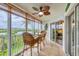 Enclosed lanai with a view, features comfortable seating and an inviting atmosphere for outdoor enjoyment at 1401 S Mccall Rd # 205, Englewood, FL 34223