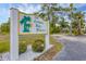 Community sign reading '1401 Lemon Bay Breezes' surrounded by landscaping at 1401 S Mccall Rd # 205, Englewood, FL 34223