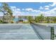 Enjoy a tennis match on a sunny day with beautiful landscaping and well-maintained tennis court at 1401 S Mccall Rd # 205, Englewood, FL 34223