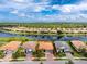 Beautiful aerial view of single-story home overlooking a lake, surrounded by lush landscaping at 1530 Hyssop Loop, North Port, FL 34289
