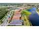 Scenic aerial shot showcases a home's lakeside location, with verdant surroundings at 1530 Hyssop Loop, North Port, FL 34289