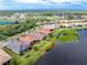 Ariel view of a well maintained home with lakeside access and beautiful landscaping at 1530 Hyssop Loop, North Port, FL 34289