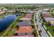 Gorgeous aerial view of the home and its well-manicured lawn in a lakeside community at 1530 Hyssop Loop, North Port, FL 34289