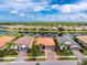 Aerial view of a property in a waterfront community with beautiful landscaping at 1530 Hyssop Loop, North Port, FL 34289