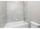 Bathroom featuring a tile shower and tub combo with a shower head at 1530 Hyssop Loop, North Port, FL 34289