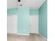 Bedroom with two doors, a ceiling fan, and neutral carpeting at 1530 Hyssop Loop, North Port, FL 34289