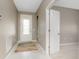 Entryway featuring a decorative front door, neutral walls, and tile flooring at 1530 Hyssop Loop, North Port, FL 34289