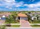 Beautiful single-Gathering home with a well-manicured lawn, beautiful plants, and a neutral color scheme at 1530 Hyssop Loop, North Port, FL 34289