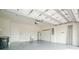 Clean and organized garage featuring painted walls, utility sink, and plenty of open space for parking at 1530 Hyssop Loop, North Port, FL 34289