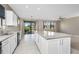 Kitchen with center island, stainless steel appliances, and sliding glass doors at 1530 Hyssop Loop, North Port, FL 34289