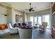 Welcoming lounge area featuring cozy seating, soft lighting, and stylish decor, exudes comfort at 1530 Hyssop Loop, North Port, FL 34289