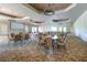 The meeting room has neutral walls, patterned carpet, and modern chandeliers at 1530 Hyssop Loop, North Port, FL 34289