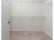 A walk-in closet featuring neutral carpet and white wire shelving at 1530 Hyssop Loop, North Port, FL 34289