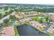 An aerial shot features a waterfront community with mature trees and gorgeous landscaping at 2004 Longpointe Cir # E2, Venice, FL 34293
