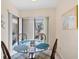 Eat in kitchen with a round glass table and a view of the patio at 2004 Longpointe Cir # E2, Venice, FL 34293