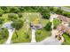 Aerial view of the home with a pool, a patio, solar panels, and multiple storage sheds at 2541 Northway Dr, Venice, FL 34292