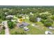 Aerial shot of a home with a screened-in pool, large yard, patio, and solar panels at 2541 Northway Dr, Venice, FL 34292