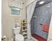 Cozy bathroom features decorative tile and a framed window above the toilet at 2541 Northway Dr, Venice, FL 34292