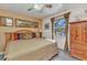 Inviting bedroom with a comfortable bed, window, and wooden dresser, creating a cozy and relaxing space at 2541 Northway Dr, Venice, FL 34292